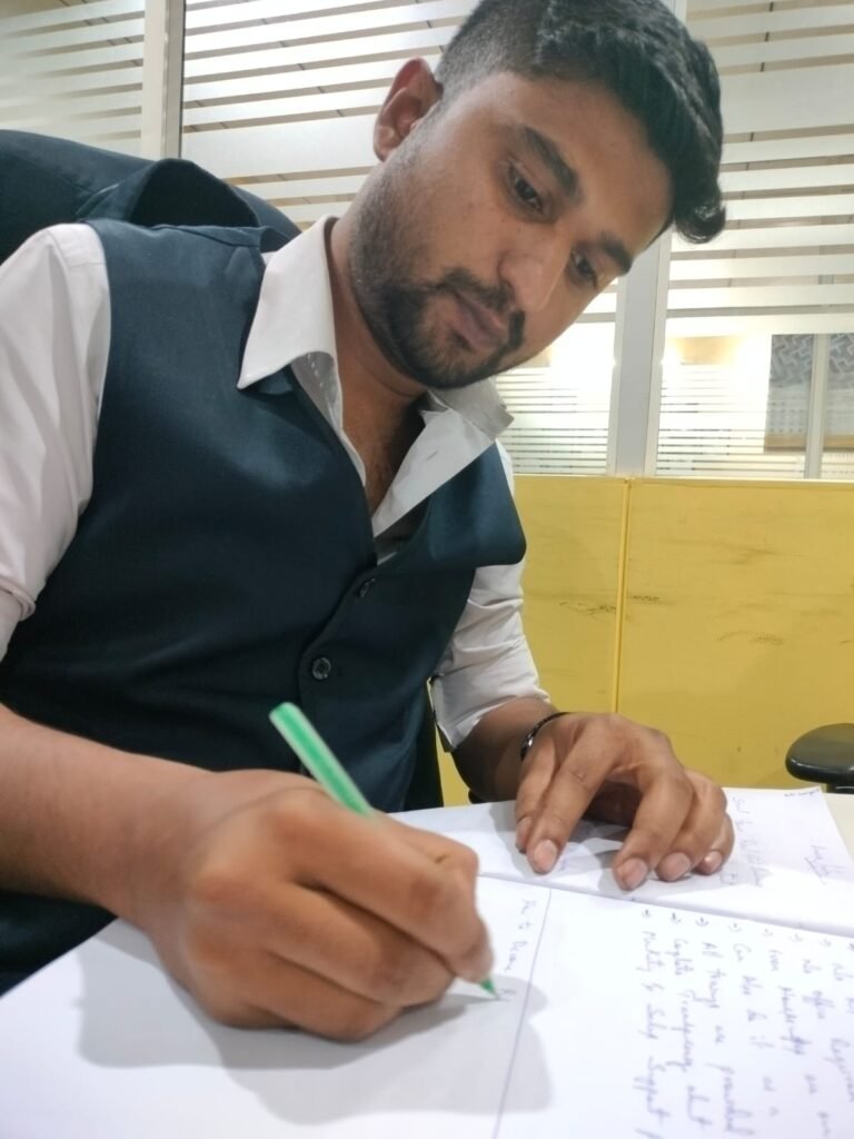 Mohammed Bilal Siddiqui planning a business system on paper